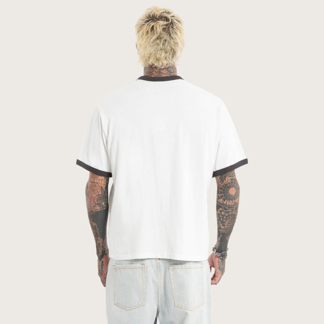 Model wears Disorder Rocker Tee Natural White T-Shirts in White - Image 3
