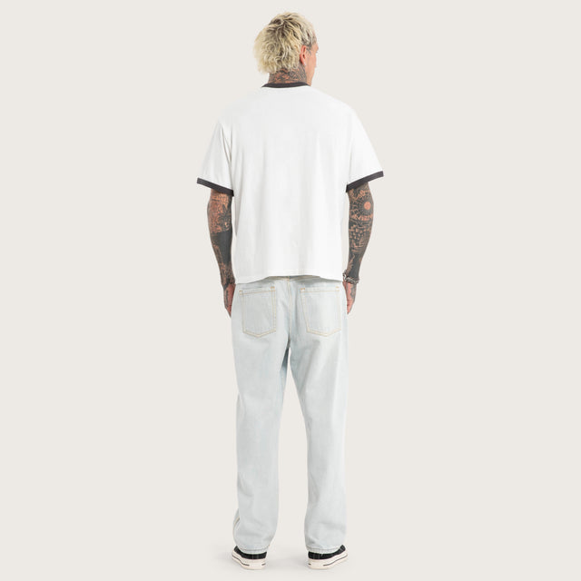 Model wears Disorder Rocker Tee Natural White T-Shirts in White - Image 4