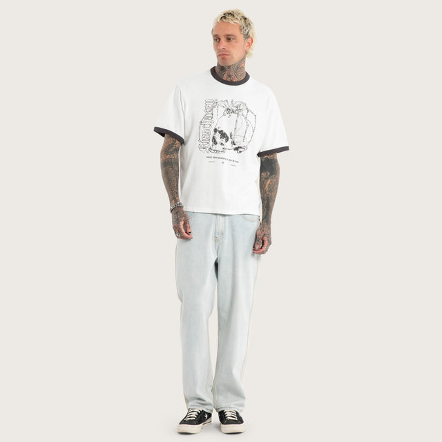 Model wears Disorder Rocker Tee Natural White T-Shirts in White - Image 5