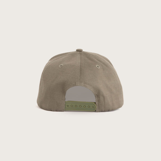 Model wears Command Cap Khaki Cap in Green - Image 3