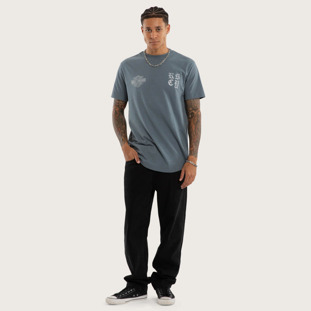 Model wears Rustline Dual Curved Tee Stormy Weather T-Shirts Blue – image 5