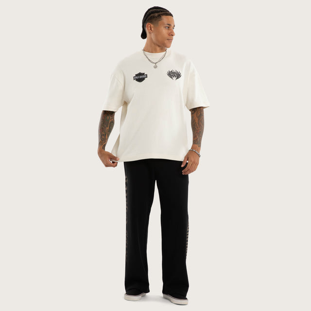 Model wears Twin Razor Trackpant Jet Black Trackpants Black – image 5