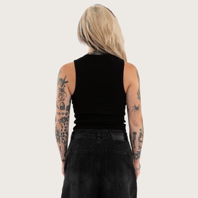 Model wears Torque Rib Tank Top Jet Black Singlet in Black - Image 3