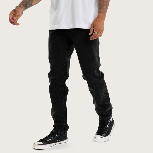 Model wears K3 Slim Jean Jet Black Pants Black – image 3