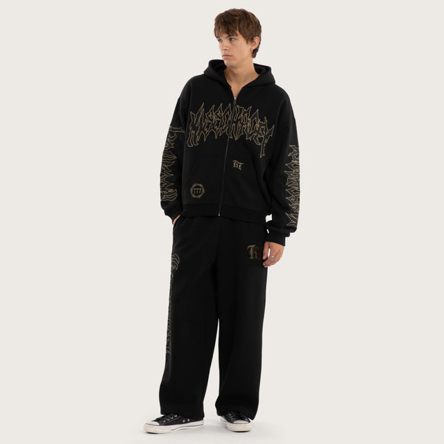 Model wears Wraith Baggy Sweatpant Jet Black Trackpants in Black - Image 2