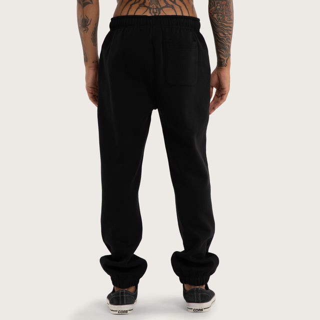 Model wears Cobalt Straight Trackpant Jet Black Trackpants in Black - Image 5