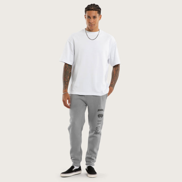 Model wears Sinner Trackpant Ultimate Grey Trackpants in Grey - Image 3