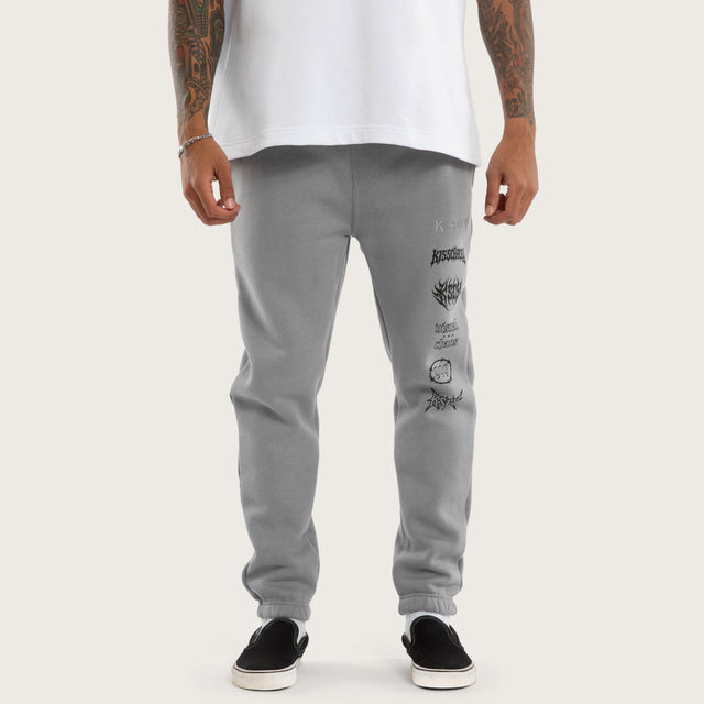 Model wears Sinner Trackpant Ultimate Grey Trackpants in Grey - Image 4
