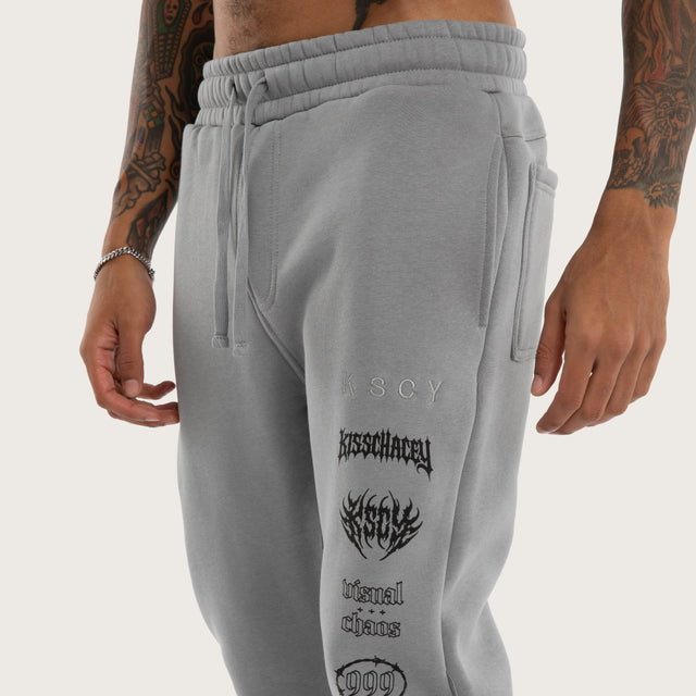 Model wears Sinner Trackpant Ultimate Grey Trackpants in Grey - Image 2