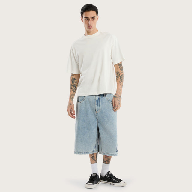 Model wears K7 Super Baggy Jorts Light Blue Shorts in 0 - Image 2