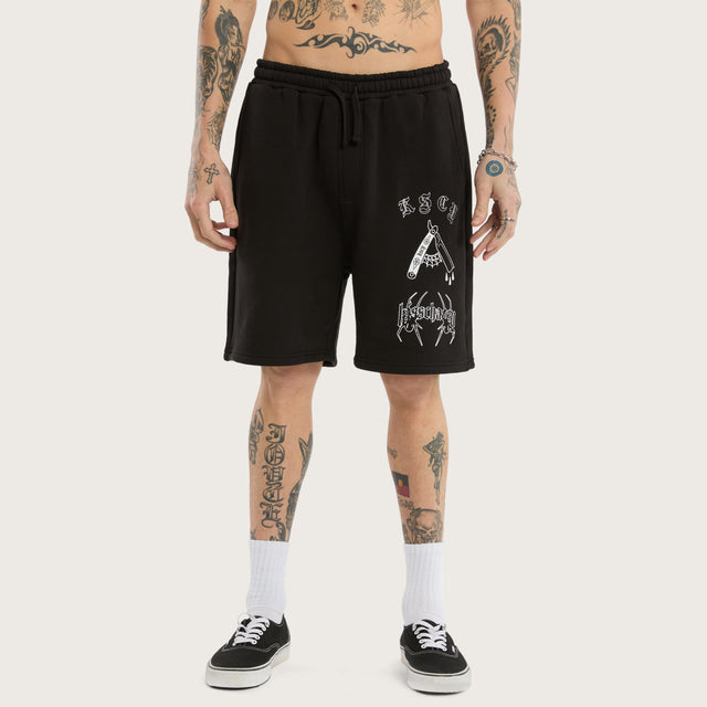 Model wears Close Shave Trackshort Jet Black Trackshorts in Black - Image 3