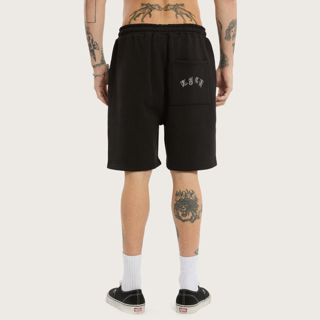 Model wears Close Shave Trackshort Jet Black Trackshorts in Black - Image 6