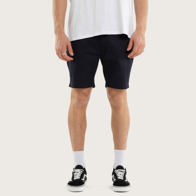 Model wears Wyvern Short Navy Shorts Blue – image 1