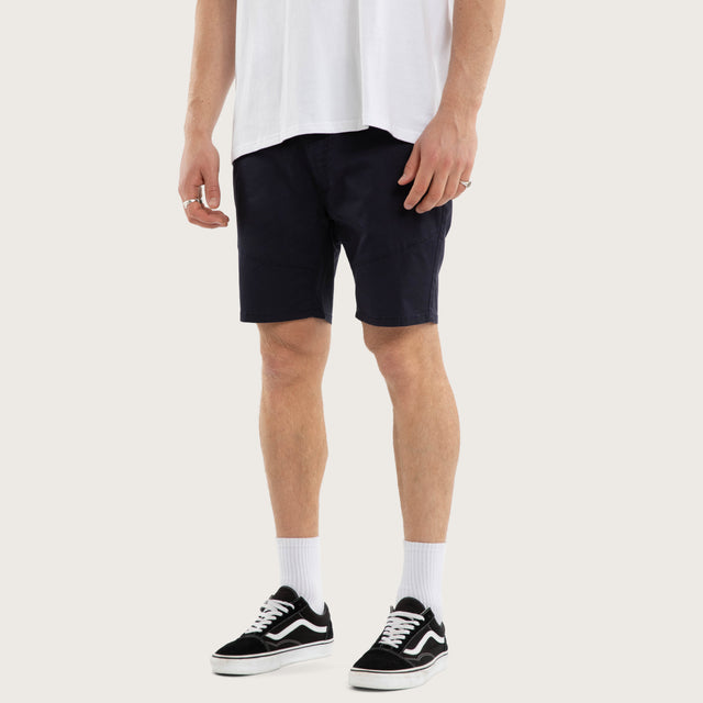 Model wears Wyvern Short Navy Shorts Blue – image 3