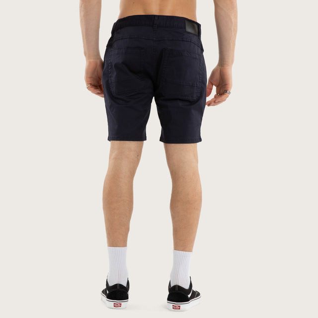 Model wears Wyvern Short Navy Shorts Blue – image 5