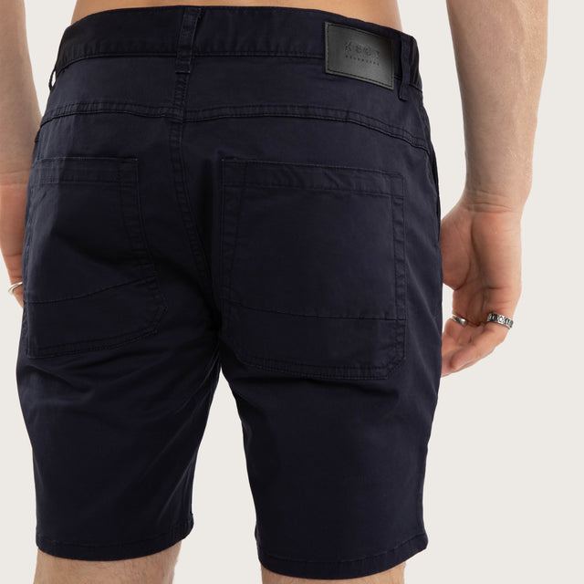 Model wears Wyvern Short Navy Shorts Blue – image 6
