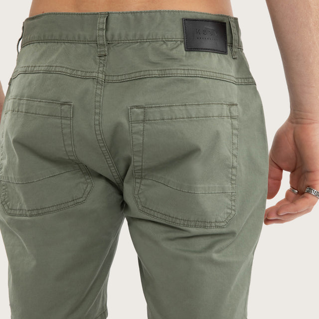 Model wears Wyvern Short Olive Shorts Green – image 6