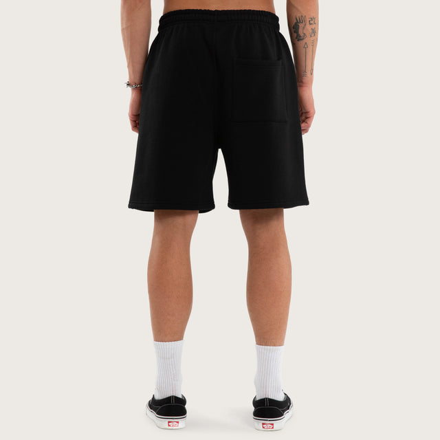 Model wears Threshold Trackshort Jet Black Trackshorts Black – image 4