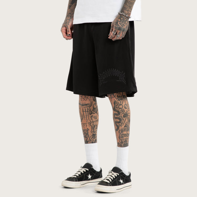 Model wears Forged Mesh Basketball Short Black Shorts in Black - Image 1