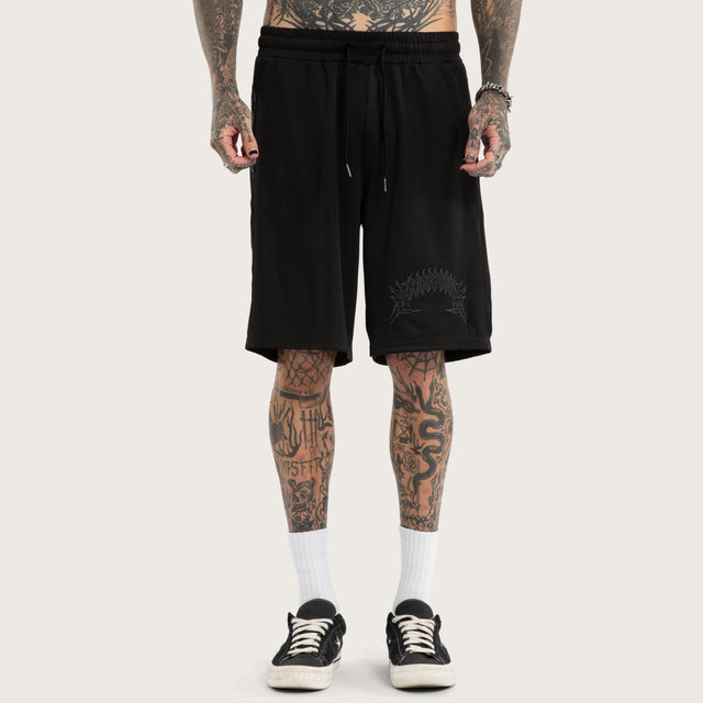 Model wears Forged Mesh Basketball Short Black Shorts in Black - Image 4