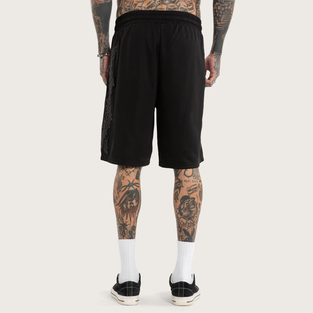 Model wears Forged Mesh Basketball Short Black Shorts in Black - Image 5