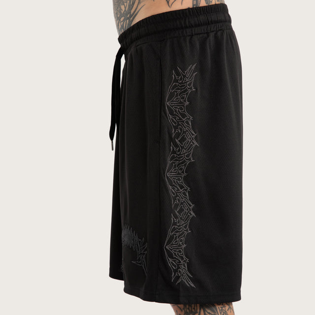 Model wears Forged Mesh Basketball Short Black Shorts in Black - Image 3