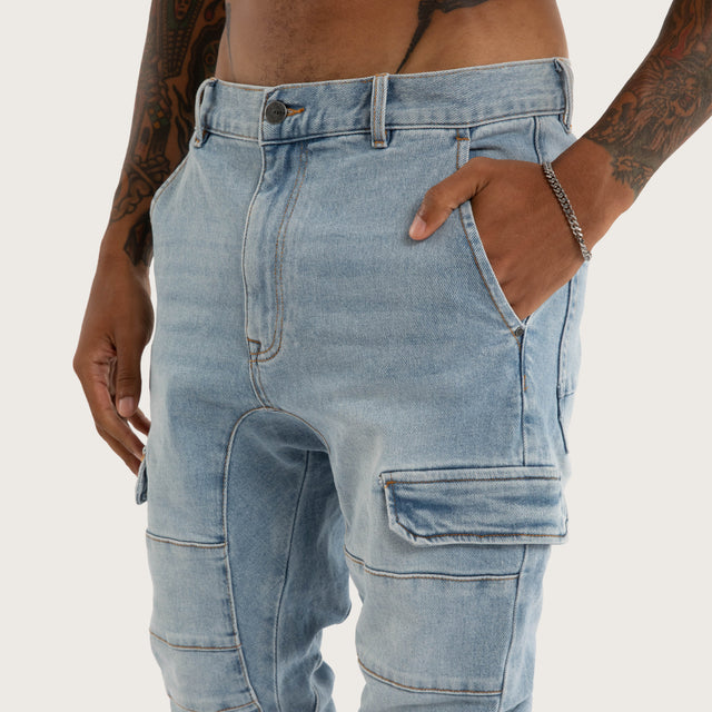 Model wears Salem Cargo Jogger Sunbleached Blue Pants in Blue - Image 5