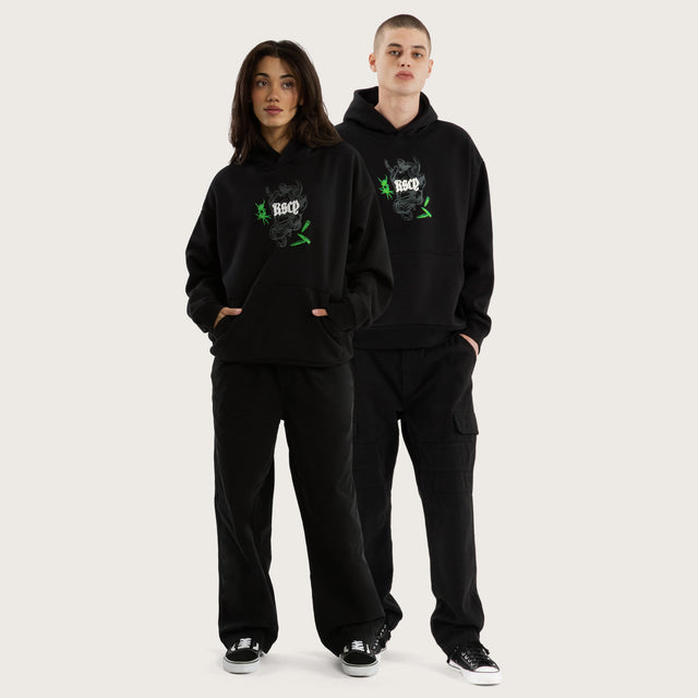 Model wears Wither Oversized Hoodie Jet Black Hoodies in Black - Image 7