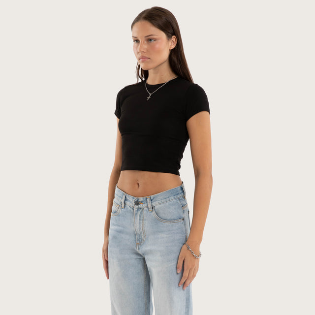 Model wears Roux Baby Tee Jet Black T-Shirts in Black - Image 3