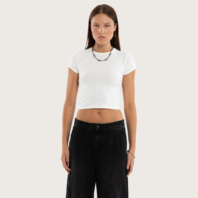 Model wears Roux Baby Tee Natural White T-Shirts in White - Image 1