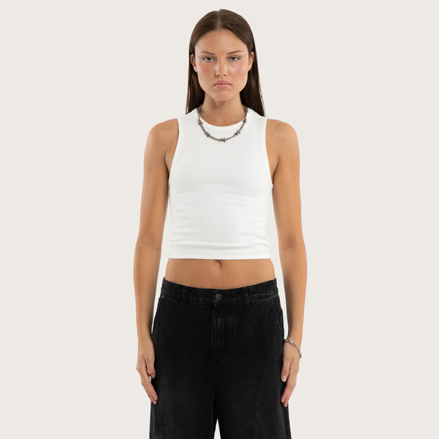 Model wears Marais Rib Tank Natural White Tanks in White - Image 1
