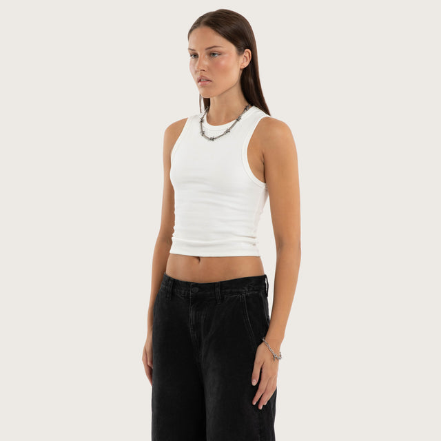 Model wears Marais Rib Tank Natural White Tanks in White - Image 3