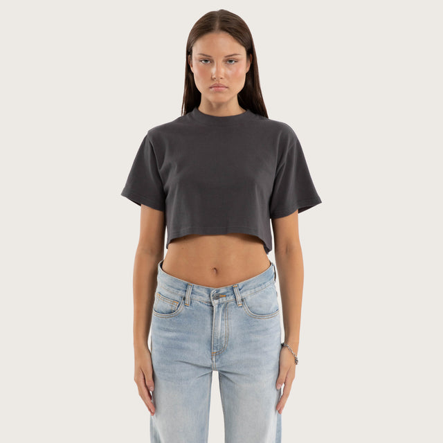Model wears Vail Crop Tee Asphalt T-Shirts in Grey - Image 1