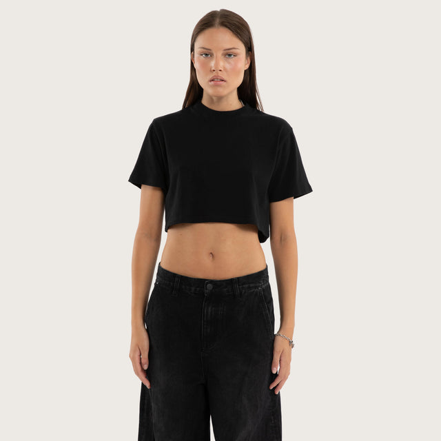 Model wears Vail Crop Tee Jet Black T-Shirts in Black - Image 1