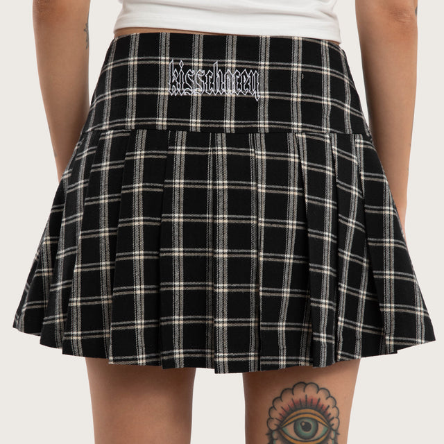 Model wears Tempest Pleated Skirt Black/White Check Skirt Black – image 4