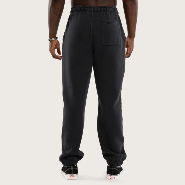 Model wears NWO 4 Life Straight Trackpant Pig/Min Anthracite Black Trackpants Black – image 2