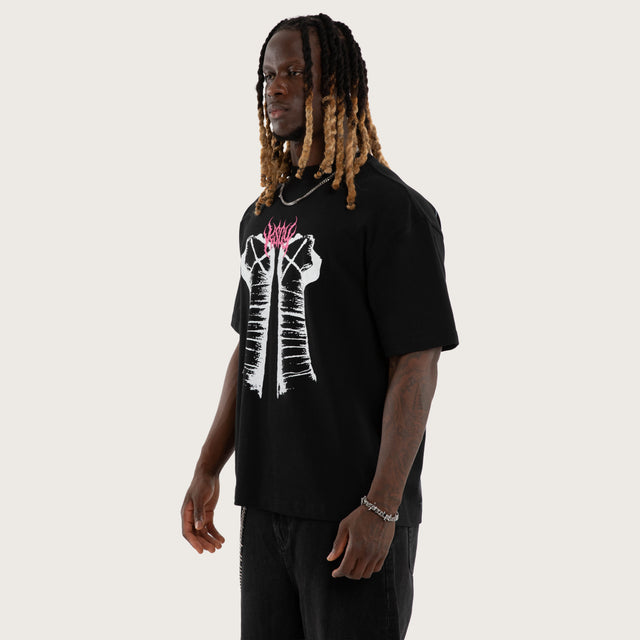 Model wears CM Pipe Bomb Street Tee Jet Black T-Shirts Black – image 4
