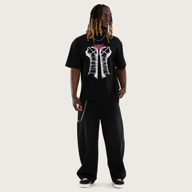 Model wears CM Pipe Bomb Street Tee Jet Black T-Shirts Black – image 2