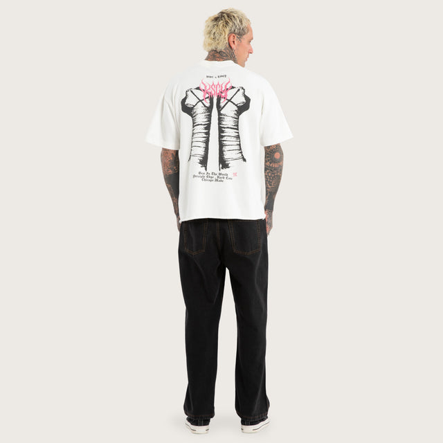Model wears CM Punk Loopback Street Tee Natural White T-Shirts White – image 6