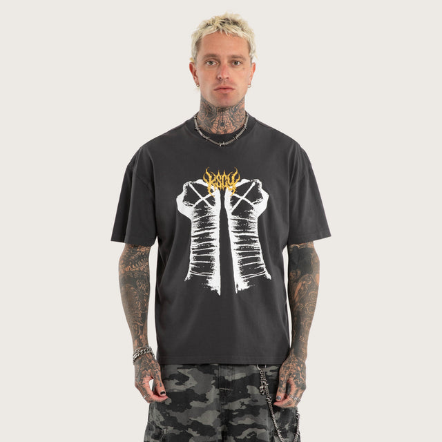 Model wears CM Punk Rage Raptor Tee Pigment Black T-Shirts Black – image 1