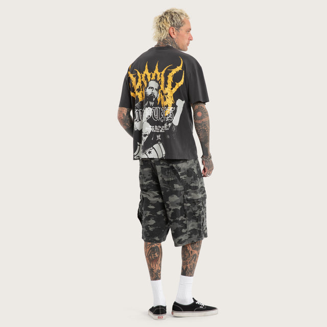Model wears CM Punk Rage Raptor Tee Pigment Black T-Shirts Black – image 4