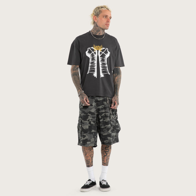 Model wears CM Punk Rage Raptor Tee Pigment Black T-Shirts Black – image 5
