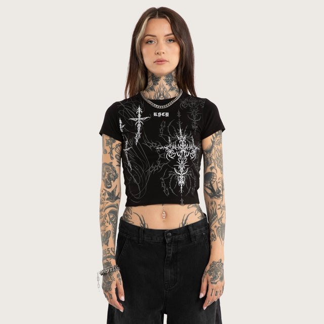 Model wears Luke Walker Lucid Baby Tee Jet Black T-Shirts in Black - Image 1