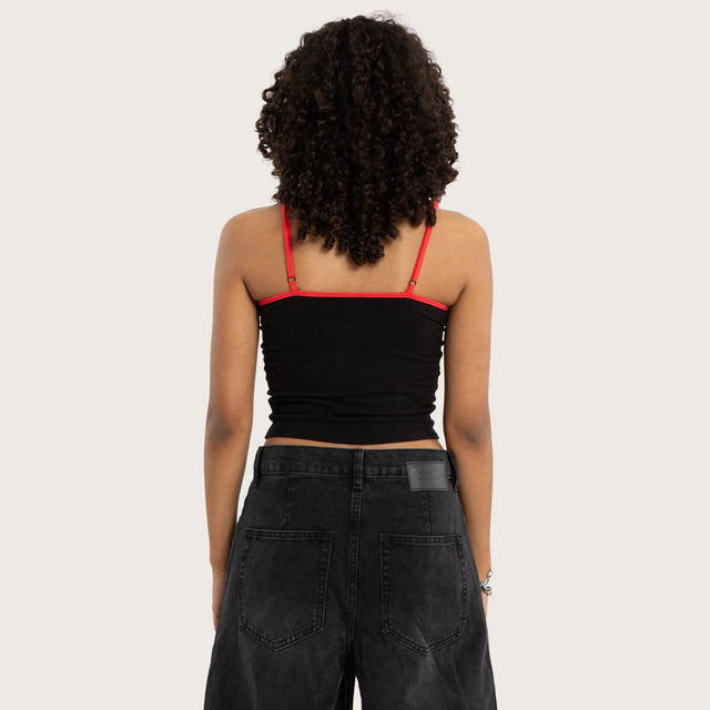 Model wears Lycoris Crop Cami Black Cami in Black Image - 3