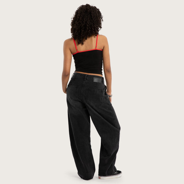 Model wears Lycoris Crop Cami Black Cami in Black Image - 4